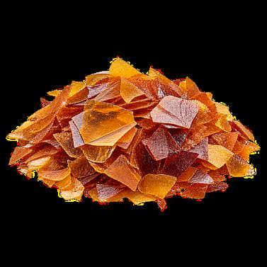 Isolated shellac flakes representing the glazing agent E904